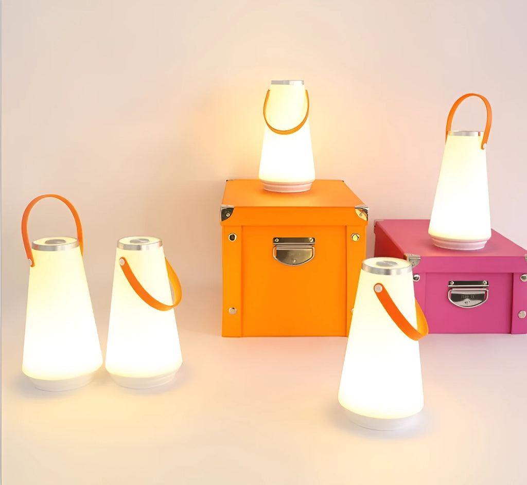 White rechargeable LED bedside table lamp with a compact ABS plastic body and soft warm white glow.
