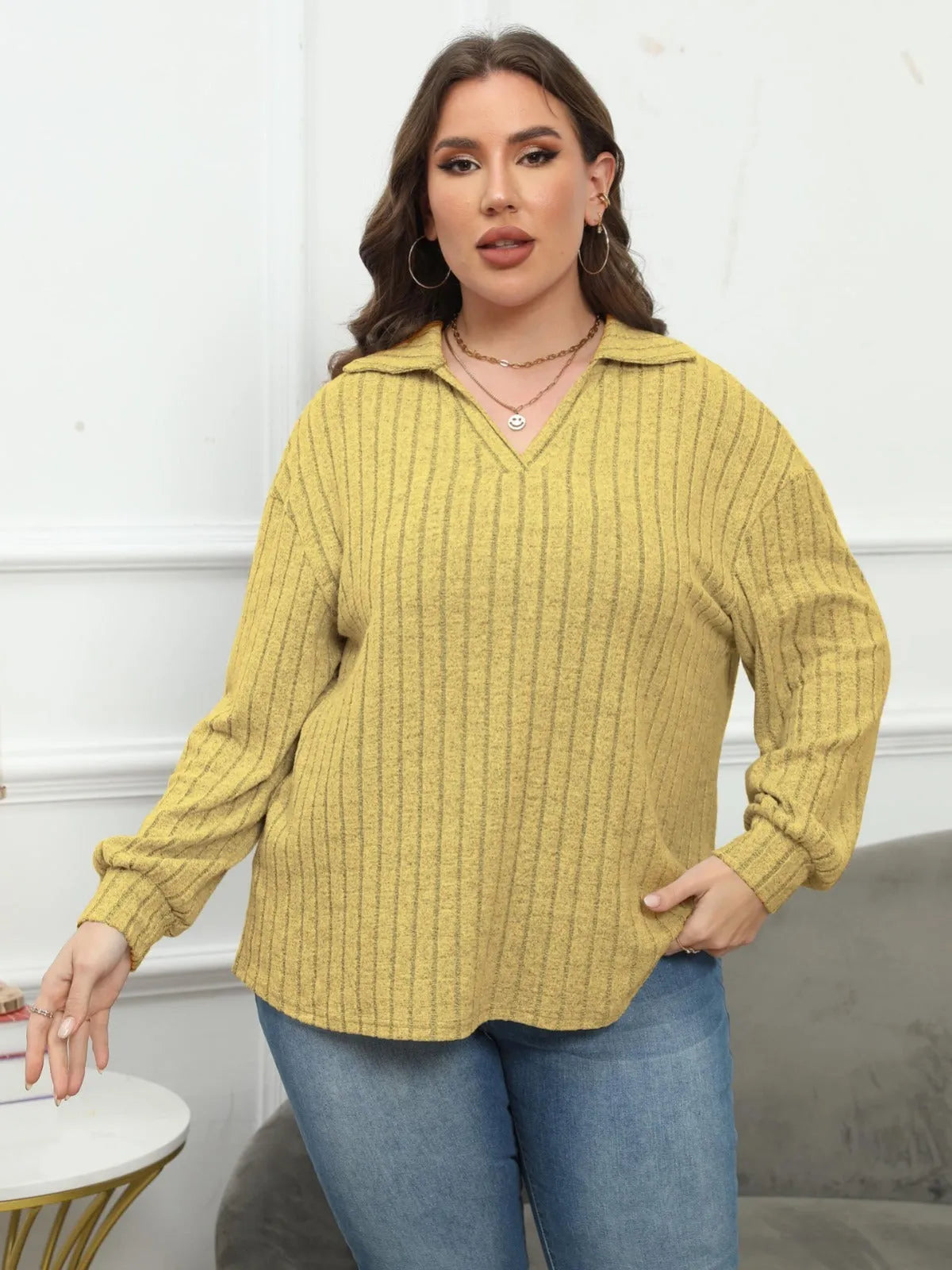Women's plus size gray polo collar shirt with lantern sleeves and collage stitching details on polar fleece fabric