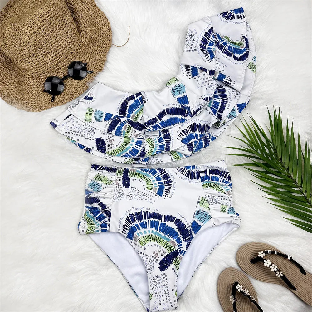 White women's one-shoulder swimsuit with large lotus leaf design and side split, double-layer front for coverage.