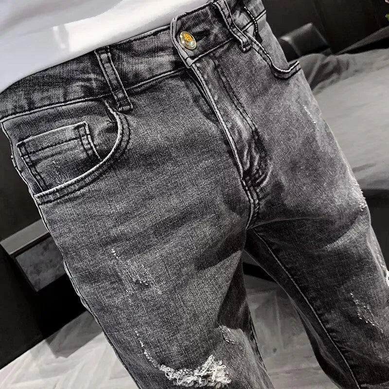 Men's high-waisted cotton denim jeans in a basic style with a button fly.