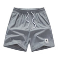 Men's elastic polyester drawstring leisure shorts in black, blue, khaki, or grey colours