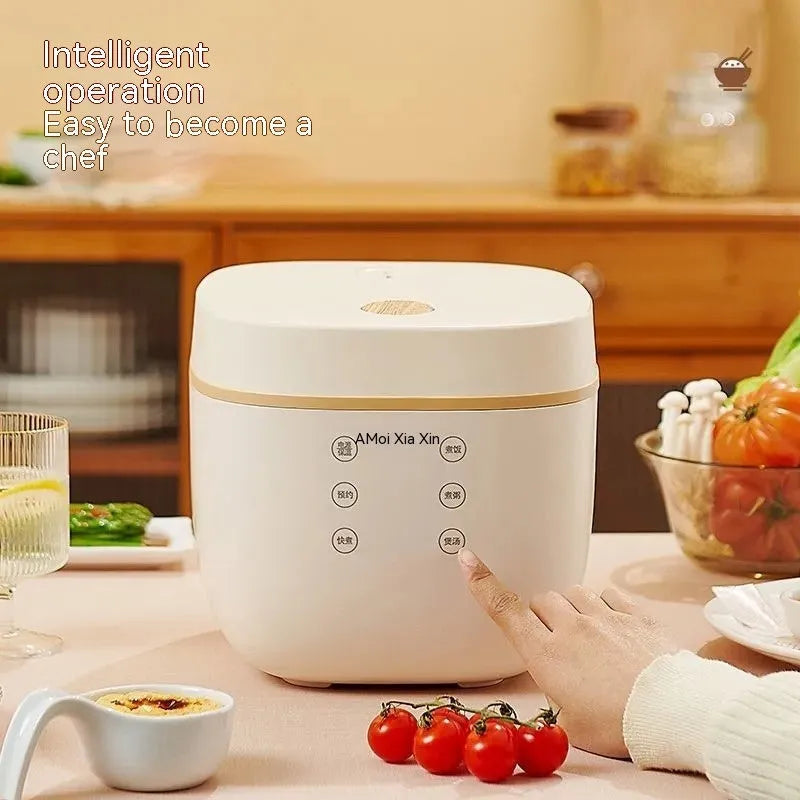 White and beige plastic multi-function 3-litre rice cooker with black inner pot and accessories.