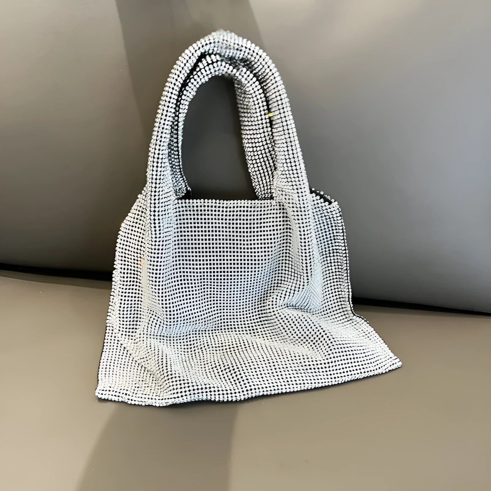 Silver cotton thread party handbag with shiny rhinestones and open outer pocket