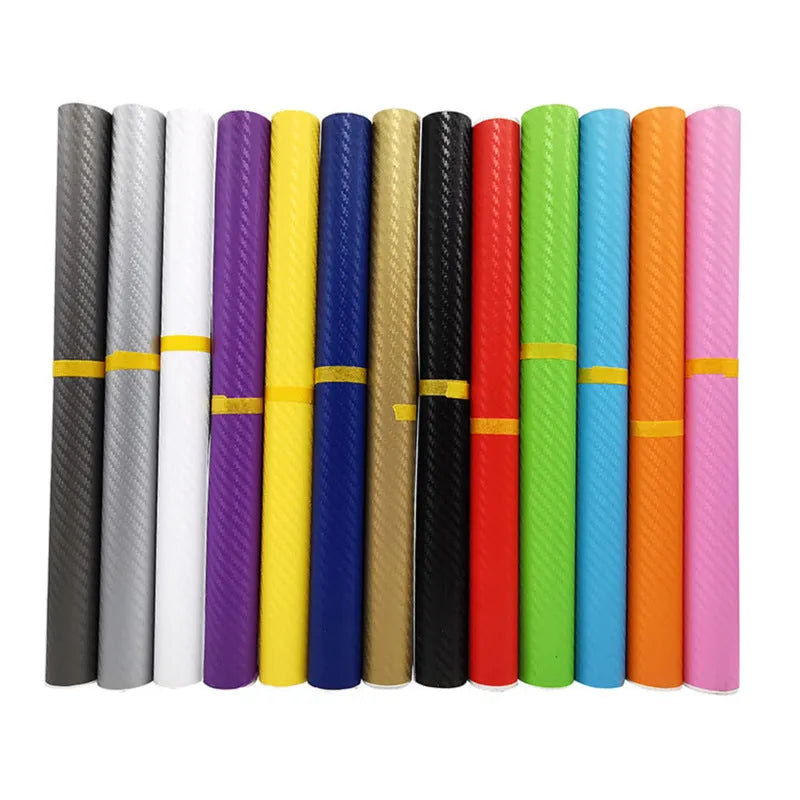 Roll of black carbon fibre textured vinyl sticker for car decoration, showing 3D pattern.