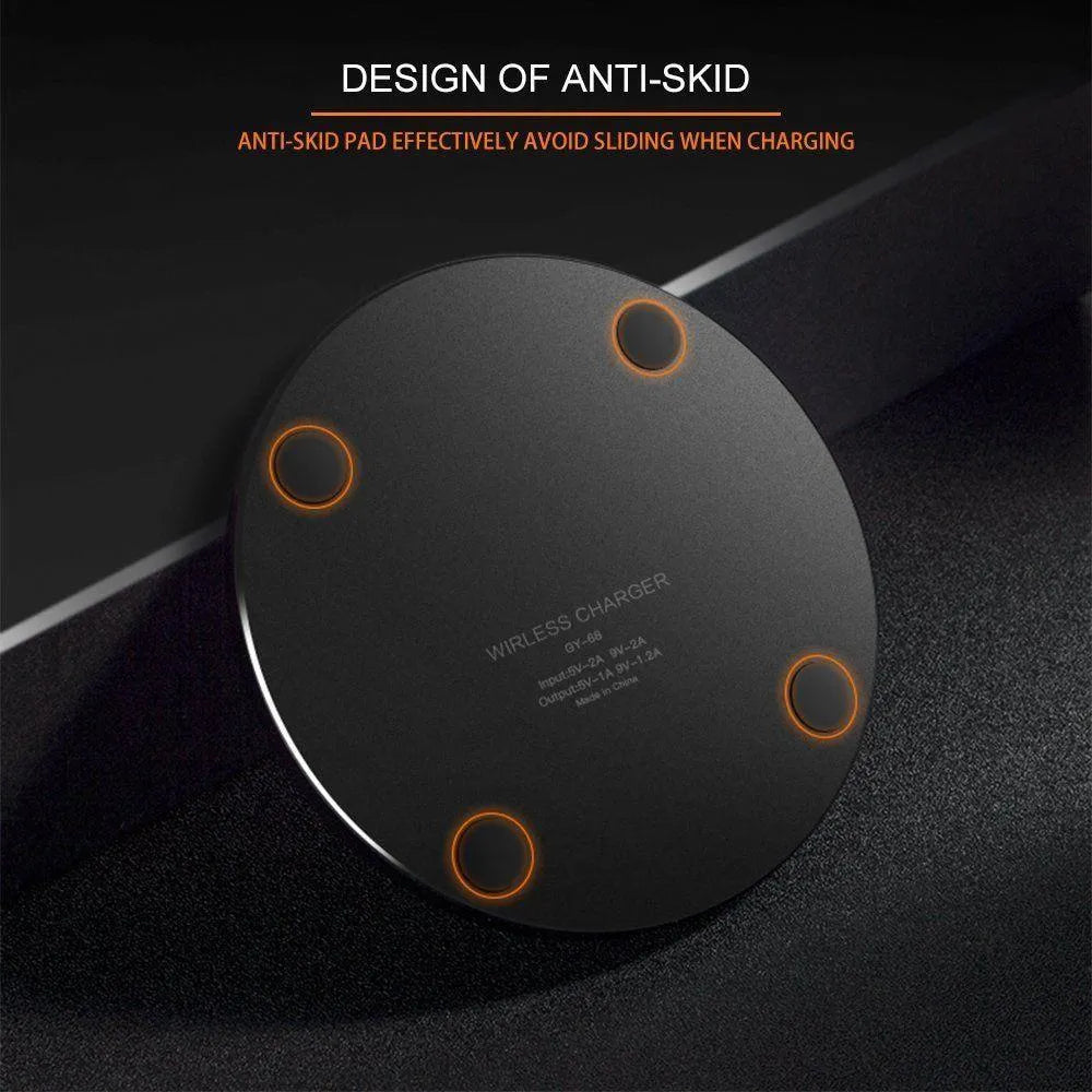 Ultra-thin black wireless charging pad measuring 98mm square with 6.5mm thickness on desk surface