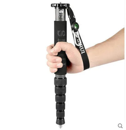 Black carbon fibre monopod for SLR cameras showing telescopic sections extended to 1540mm maximum height