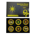 Six gold and silver anti-radiation phone stickers on backing sheet