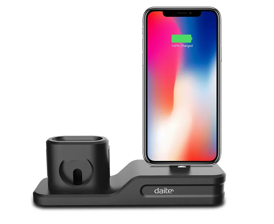 Black silicone 3-in-1 charging stand for iPhone, iWatch, and AirPods on a desk