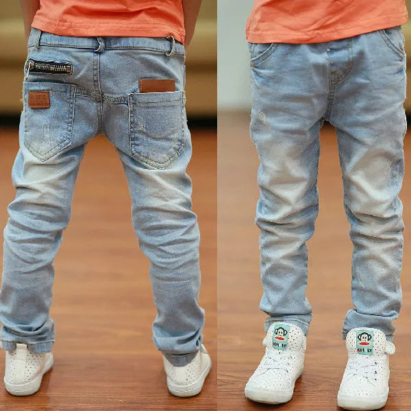 Boy wearing striped denim harem pants with an elasticated waistband, casual style for spring and autumn.