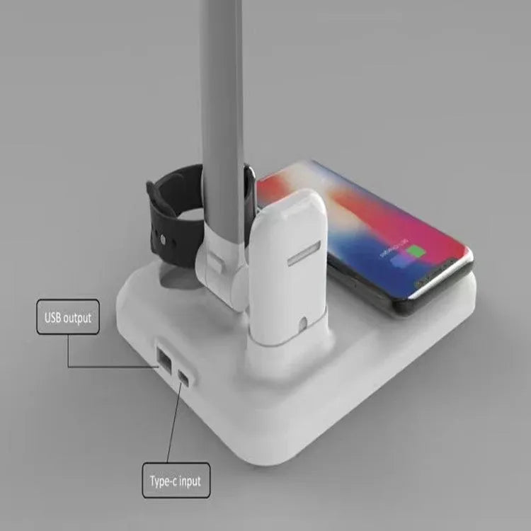 Black and white 4-in-1 LED desk lamp with integrated wireless phone charging pad visible on base