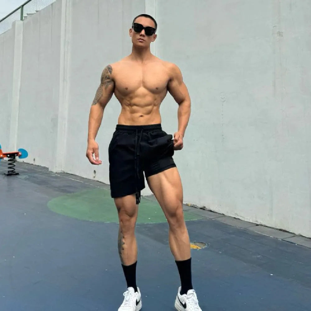 Men's ice silk quick-drying double-layer shorts in multiple colours showing quarter-length design