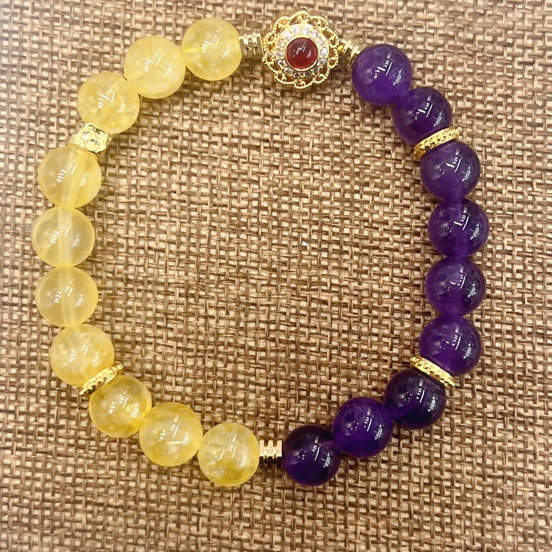 Handmade women's crystal bracelet with yellow and purple amethyst stones, manual craftsmanship