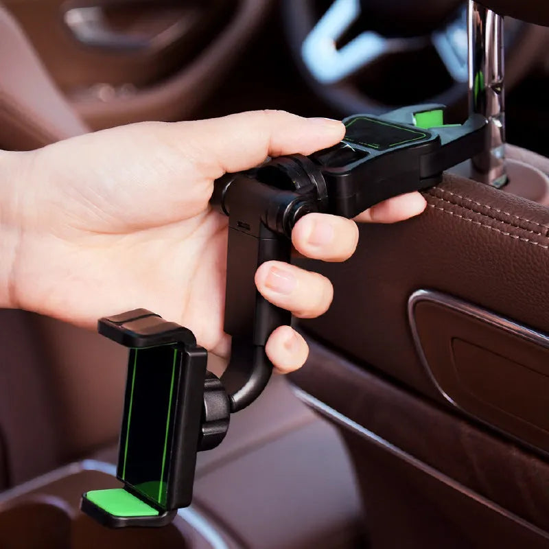Black and green car phone holder attached to rear view mirror bracket