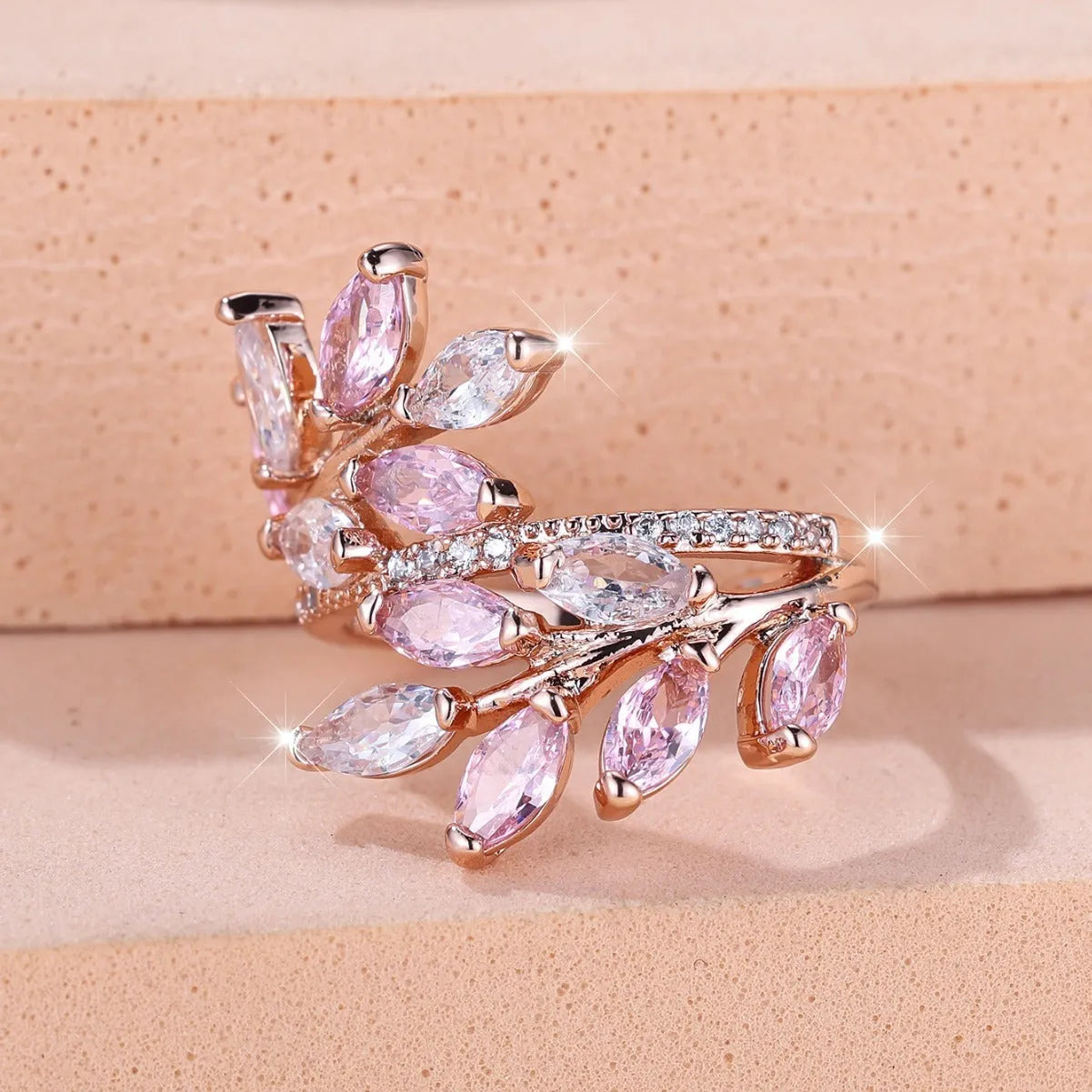 Adjustable copper leaf ring with horse eye zircon stones in multiple colour options showing botanical design