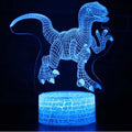 Colourful 3D dinosaur-shaped night light with multicoloured crack-style lighting effect on a table.