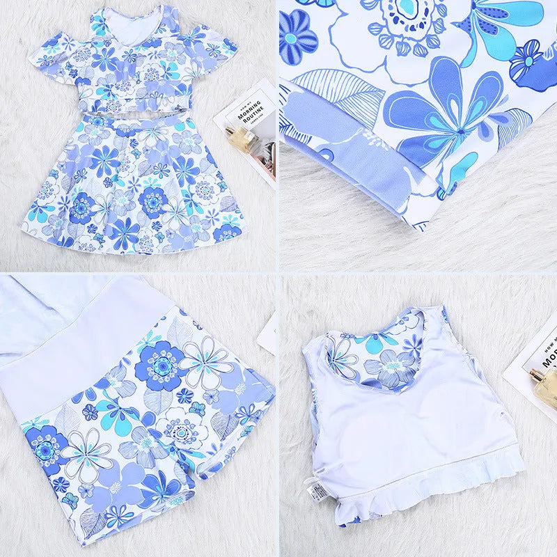 Blue floral patterned women's one-piece swim dress on hanger