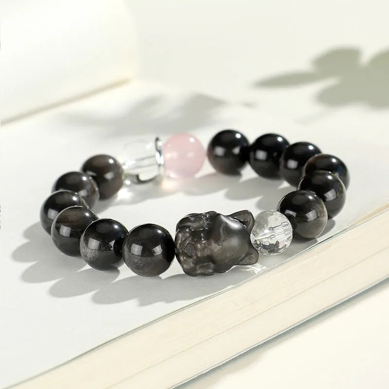 Silver stone bracelet with fox charm and pink, navy blue, black, snowflake ghost crystals.