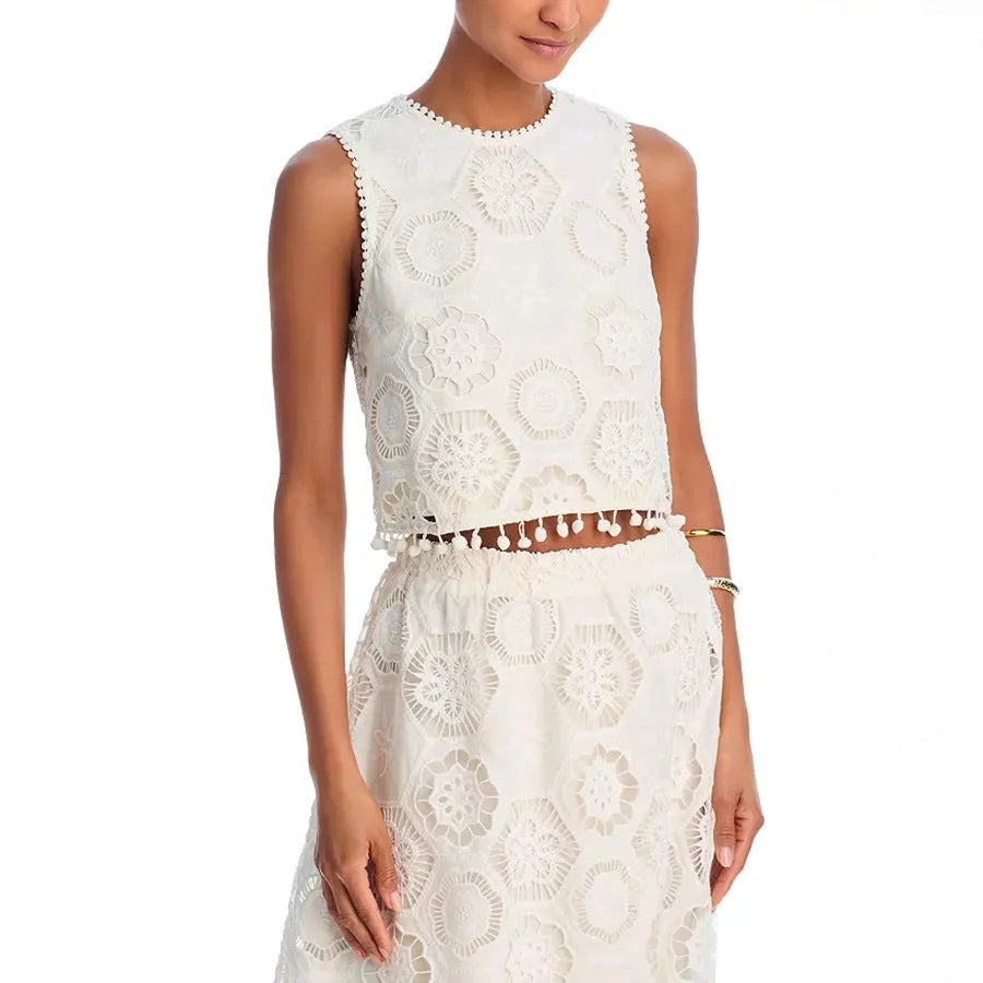 White women's suit with sleeveless top and long skirt featuring embroidery details in retro style