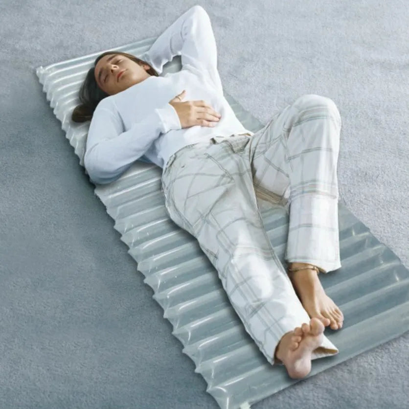 Transparent inflatable camping airbed showing dimensions and sturdy construction.