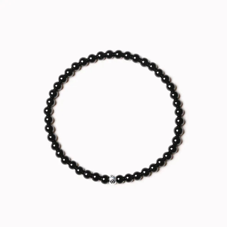Geometric agate bracelet with round and square beads in obsidian, blue San, and black agate, 4mm size.
