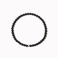 Geometric agate bracelet with round and square beads in obsidian, blue San, and black agate, 4mm size.