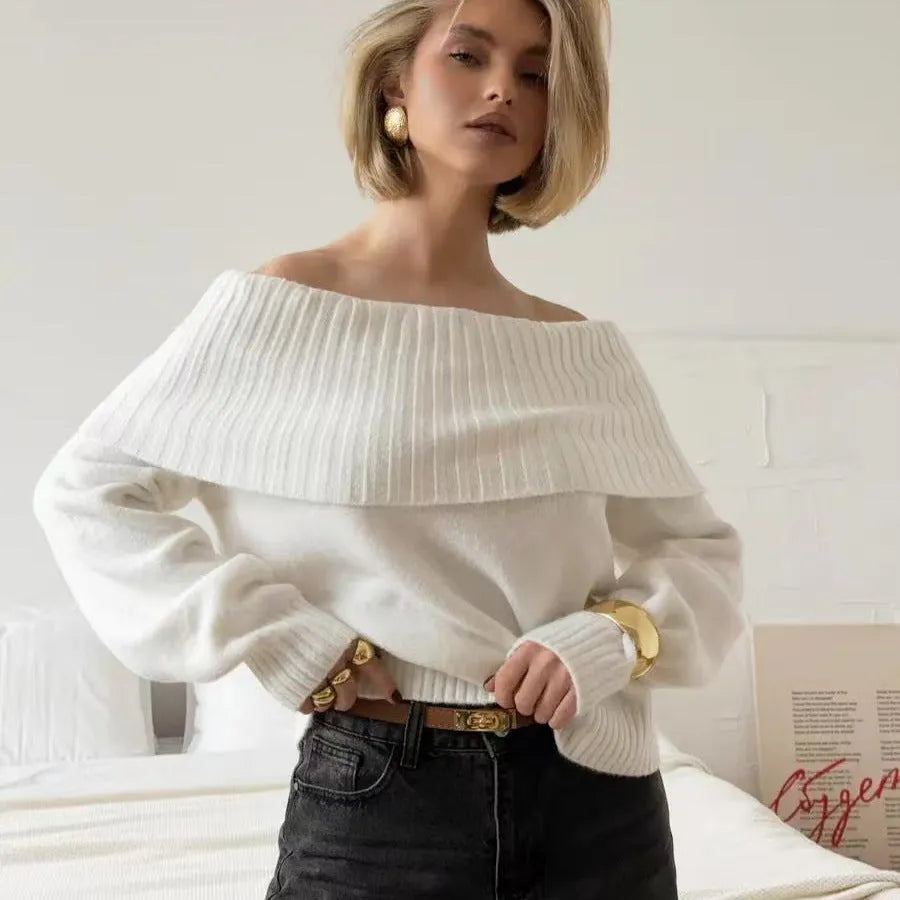 Off-the-shoulder grey sweater with 3D pattern and strapless design, showing regular sleeves and pullover style