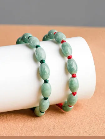 Traditional jade stone bracelet in dark green or red colour with certificate