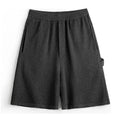 Cement grey straight-cut athletic shorts with medium elastic waistband