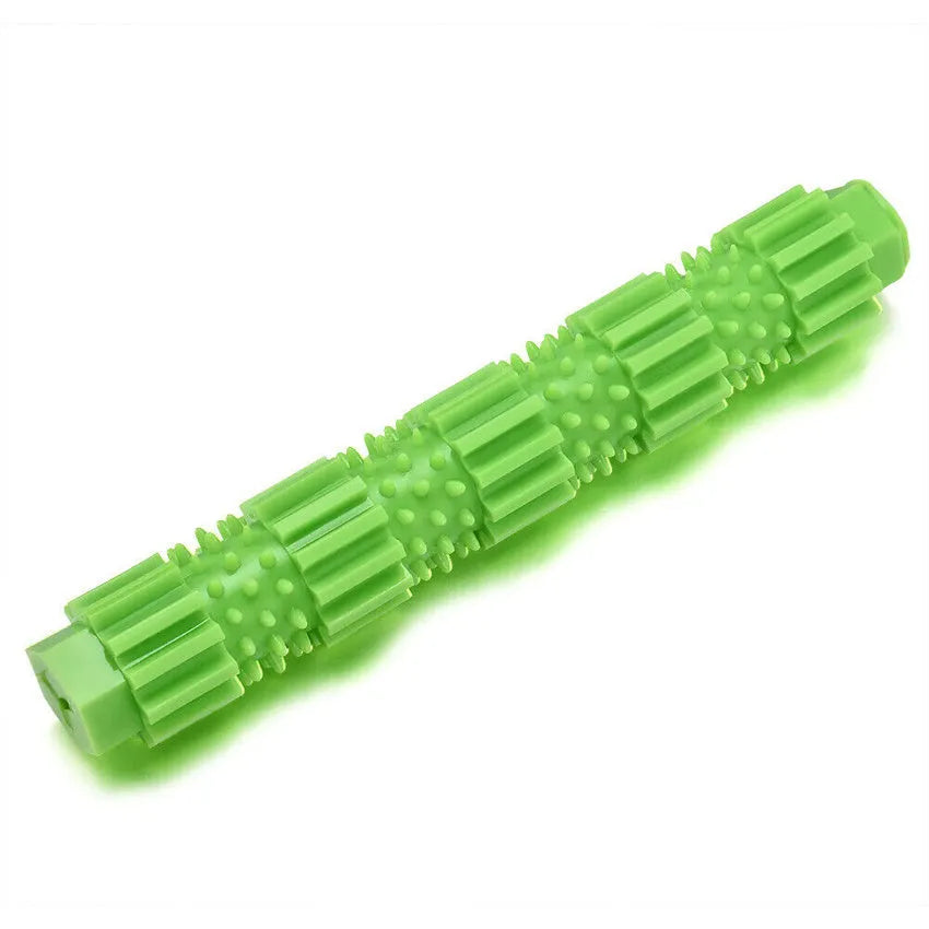 Green durable rubber dog chew toy with treat-dispensing hole and textured surface for aggressive chewers.