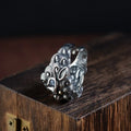 Adjustable open-style sterling silver ring with Jibeast zodiac pattern and diamond accents on finger