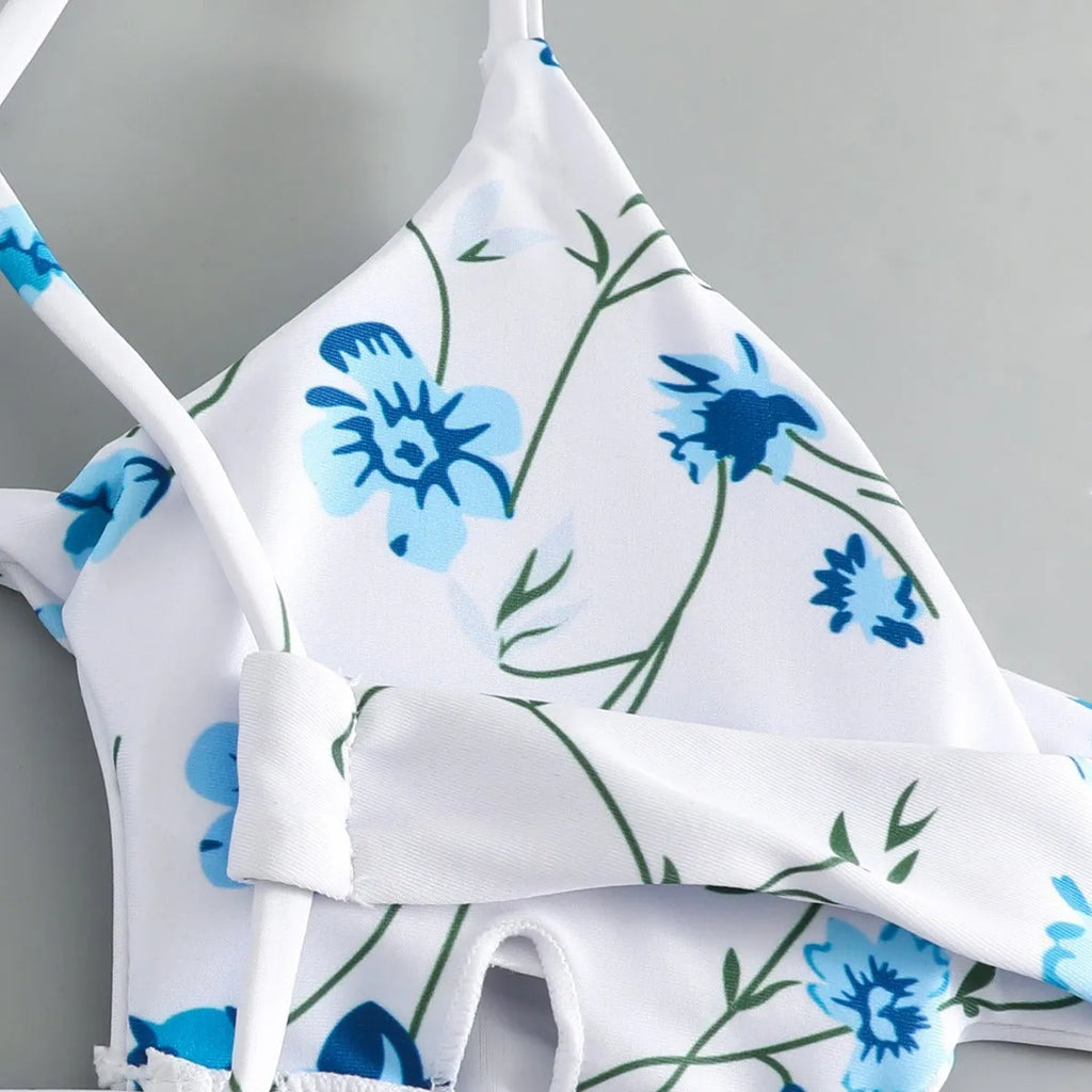 Women's floral patterned tie-neck triangle bikini top with matching shorts swimwear set