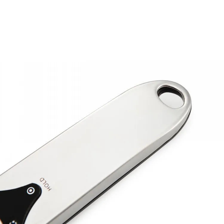 Digital measuring spoon with LCD display showing weight measurement