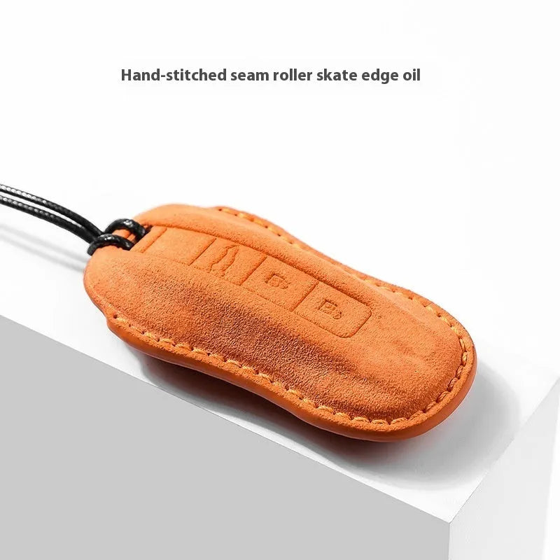 Suede car key cover in four colour options showing soft texture and key fob protection without branding