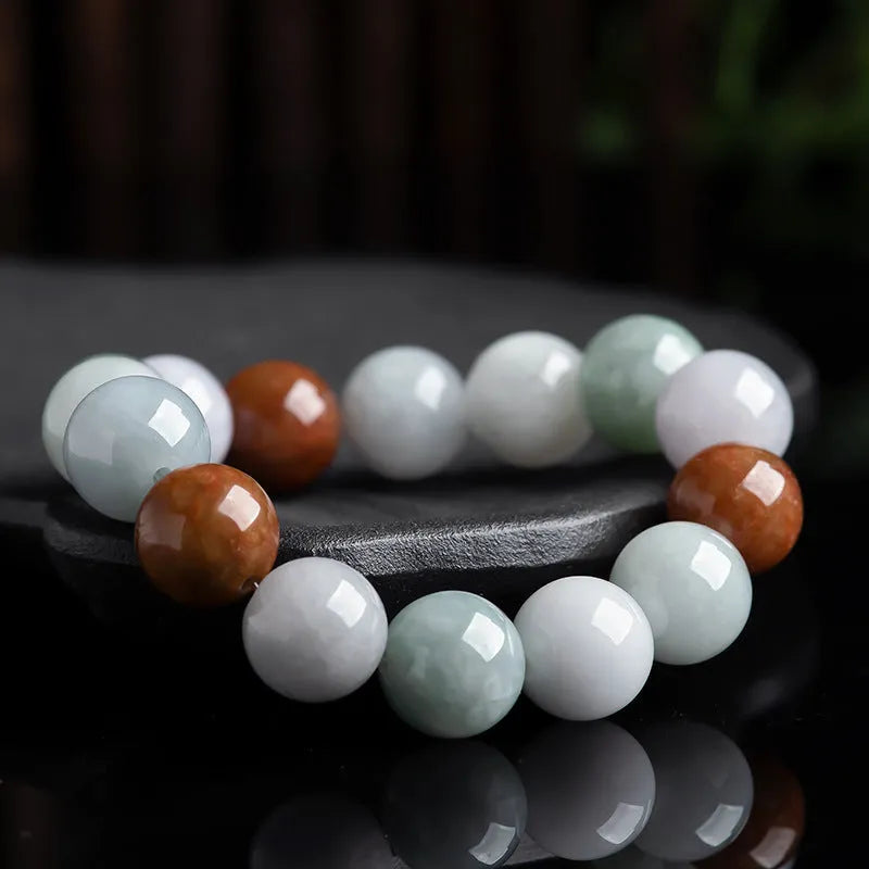 Women's Myanmar jade bracelet with 13mm round beads showing three natural jade colours