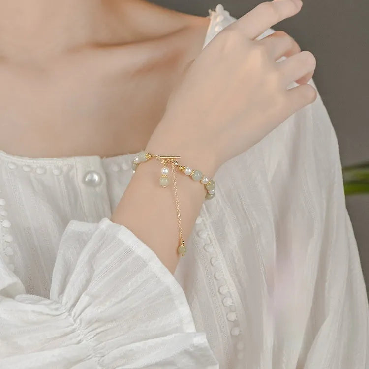 Women's Hetian jade bracelet with round pearl pendant in gold electroplated finish