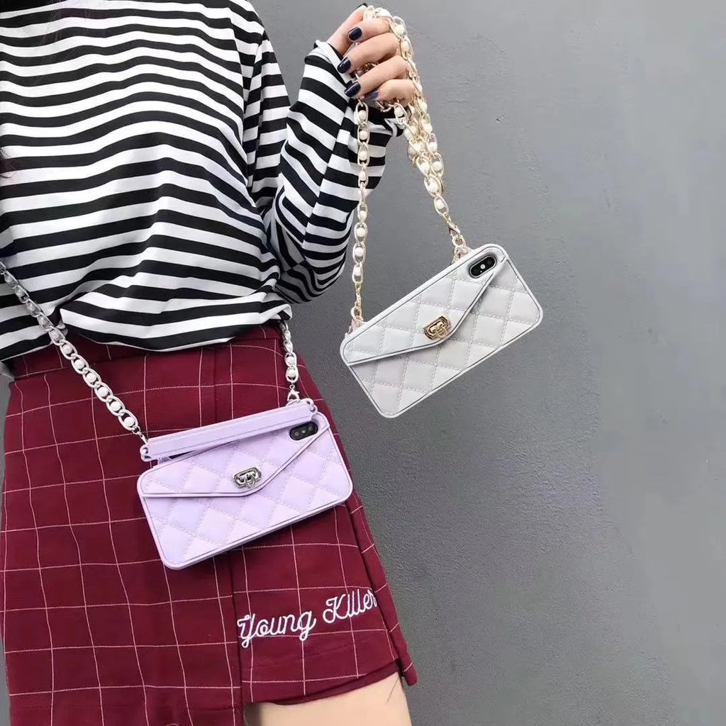 Luxury women's silicone iPhone case with pearl chain lanyard in beige colour on iPhone 13 Pro Max