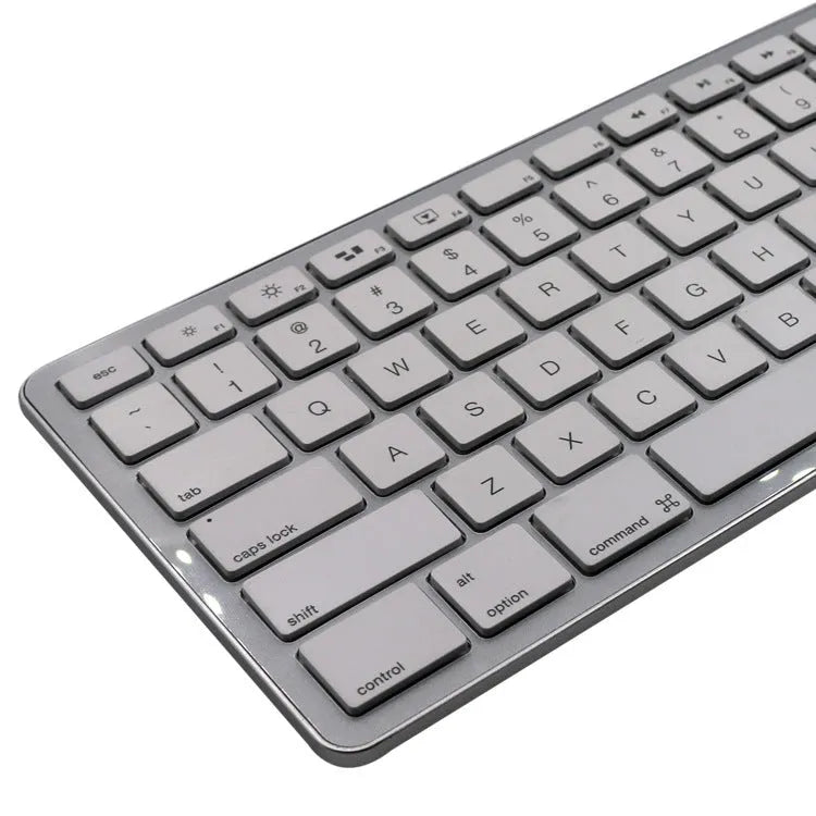 White Bluetooth wireless keyboard with 109 keys and a three-key zone on a desk.