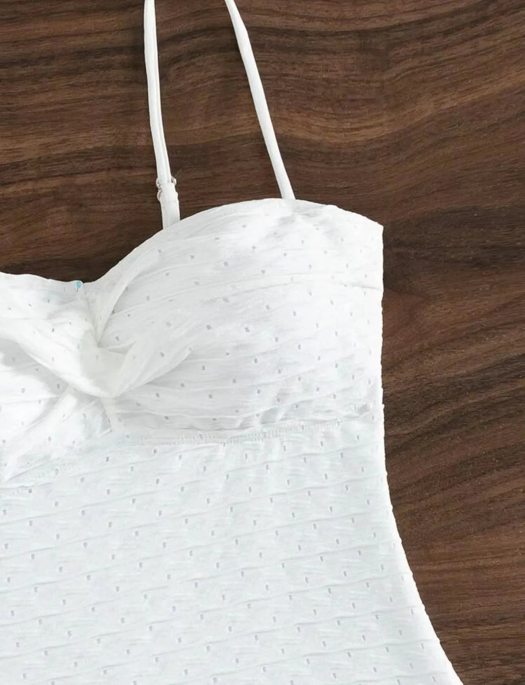 White women's one-piece swimsuit with sling style design