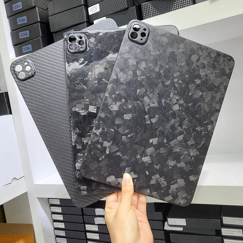 Carbon fibre flat protective cover for iPad Pro 11 showing embossed plaid pattern and precise port cutouts