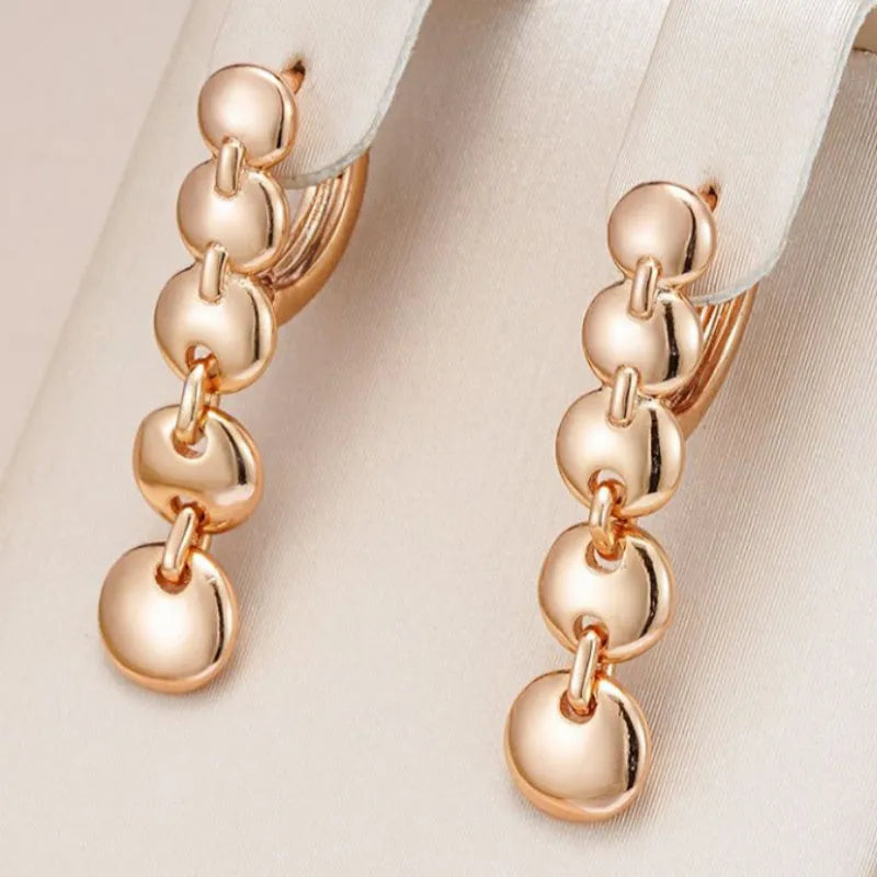 Gold-plated copper circle earrings with hand-woven texture, measuring 6cm in length