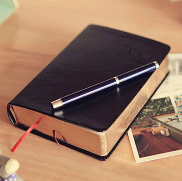 Large thick leather notebook 17 x 12 cm with 480 pages and gold or white cover.