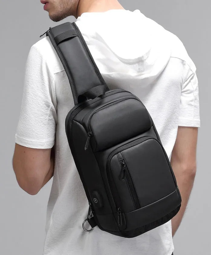 Black outdoor shoulder bag with air cushion strap and internal organisation compartments