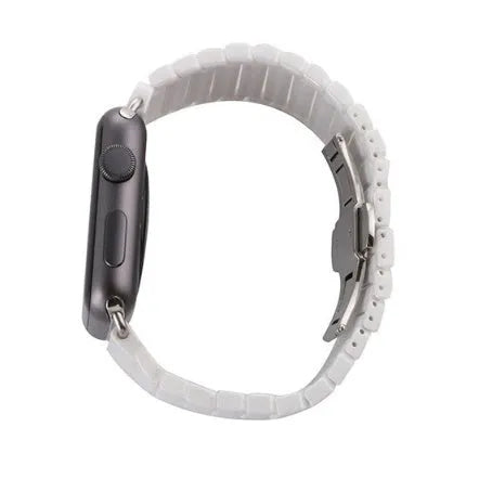Black ceramic chain link Apple Watch strap with stainless steel clasp on a 42mm watch.