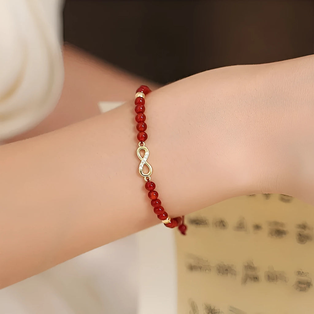 Hand-woven red agate bead bracelet with diamond pattern and lucky charm in ethnic style