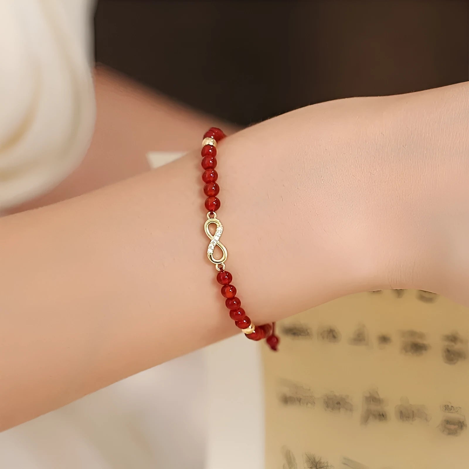 Hand-woven red agate bead bracelet with diamond pattern and lucky charm in ethnic style