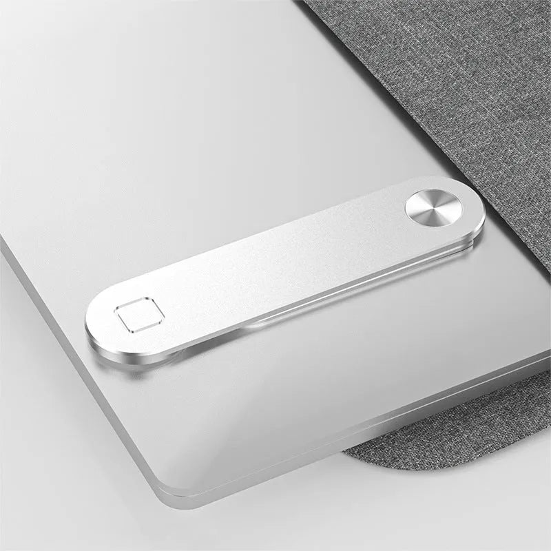 Black aluminium laptop phone holder with magnetic bracket mounted on a monitor, showing a smartphone attached for dual-screen use