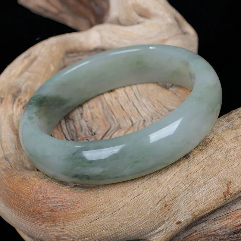 Natural Jinsi Jade Chinese-style bracelet shown in various sizes from 52mm to 62mm inner diameter.