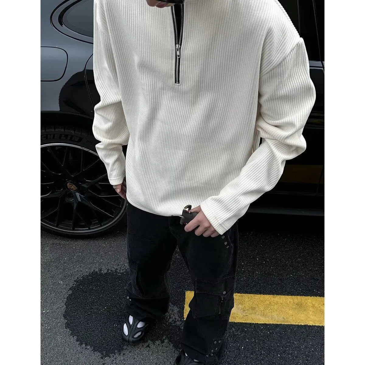 Solid colour loose fit long sleeve pullover top shown in grey, black, or apricot.
