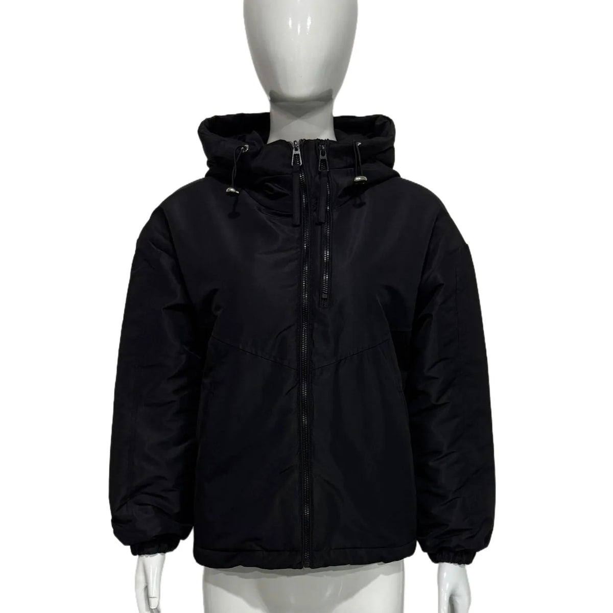 Women's loose-fit hooded shell jacket in grey shown from the front, with long sleeves and a zip front.