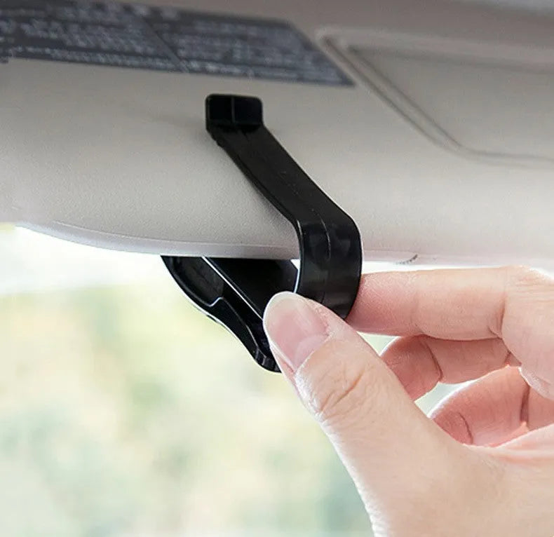 Black plastic car clip for sunshades, holding glasses and tickets, 6.5cm long